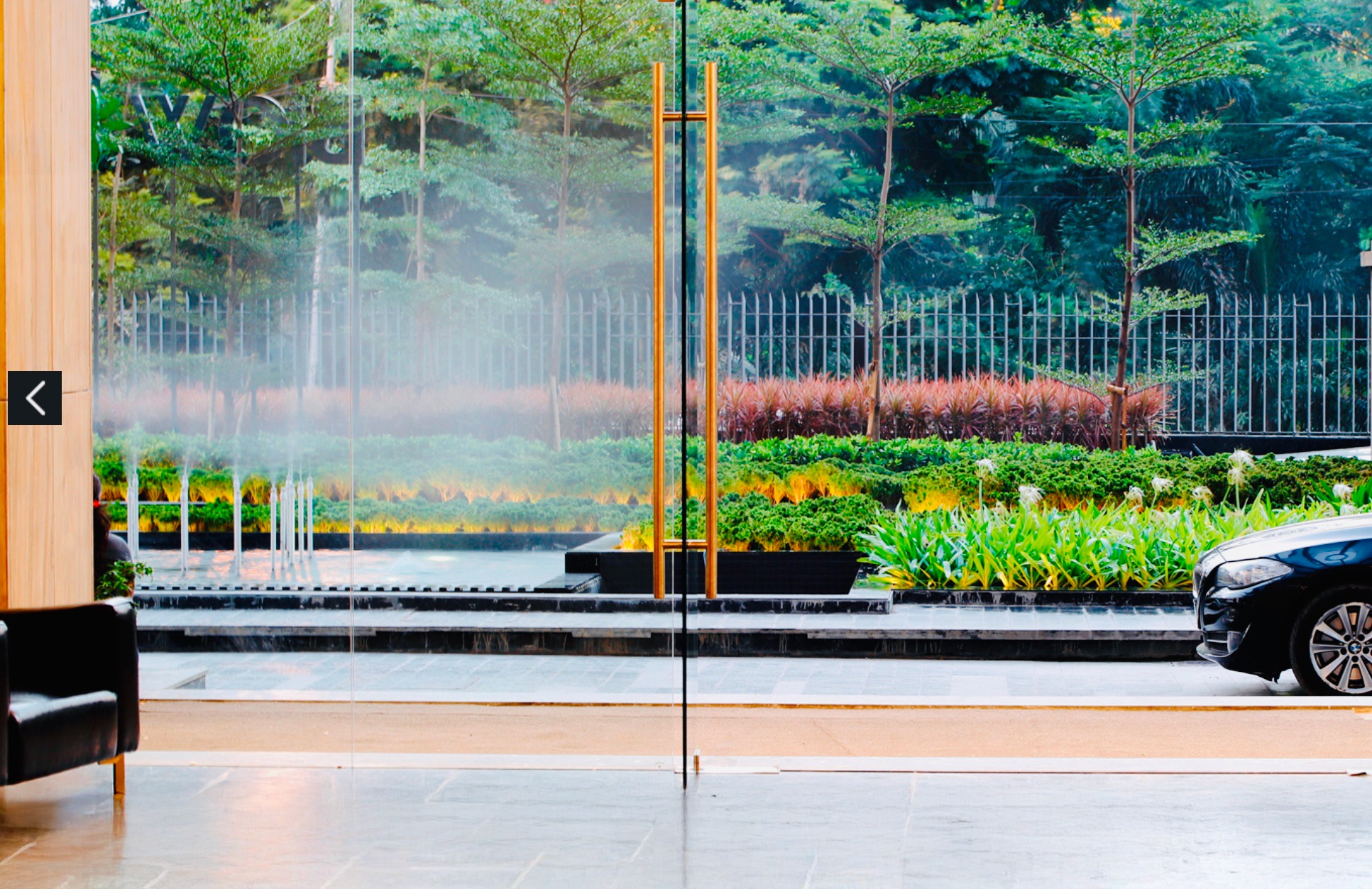 View from Biowonder’s glazed entrance towards the planted arrival garden, Kolkata