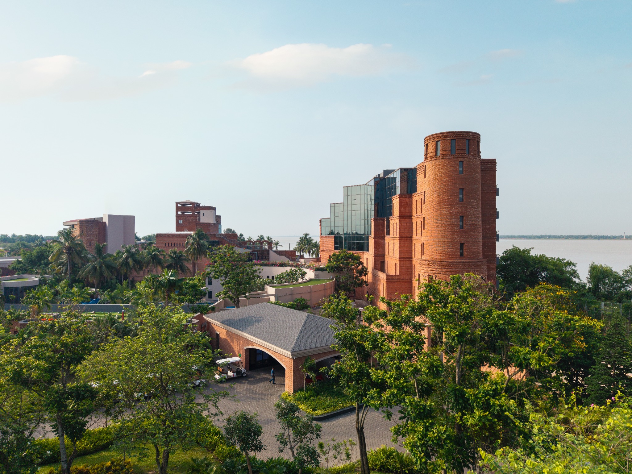 Brick facade seen through the river garden