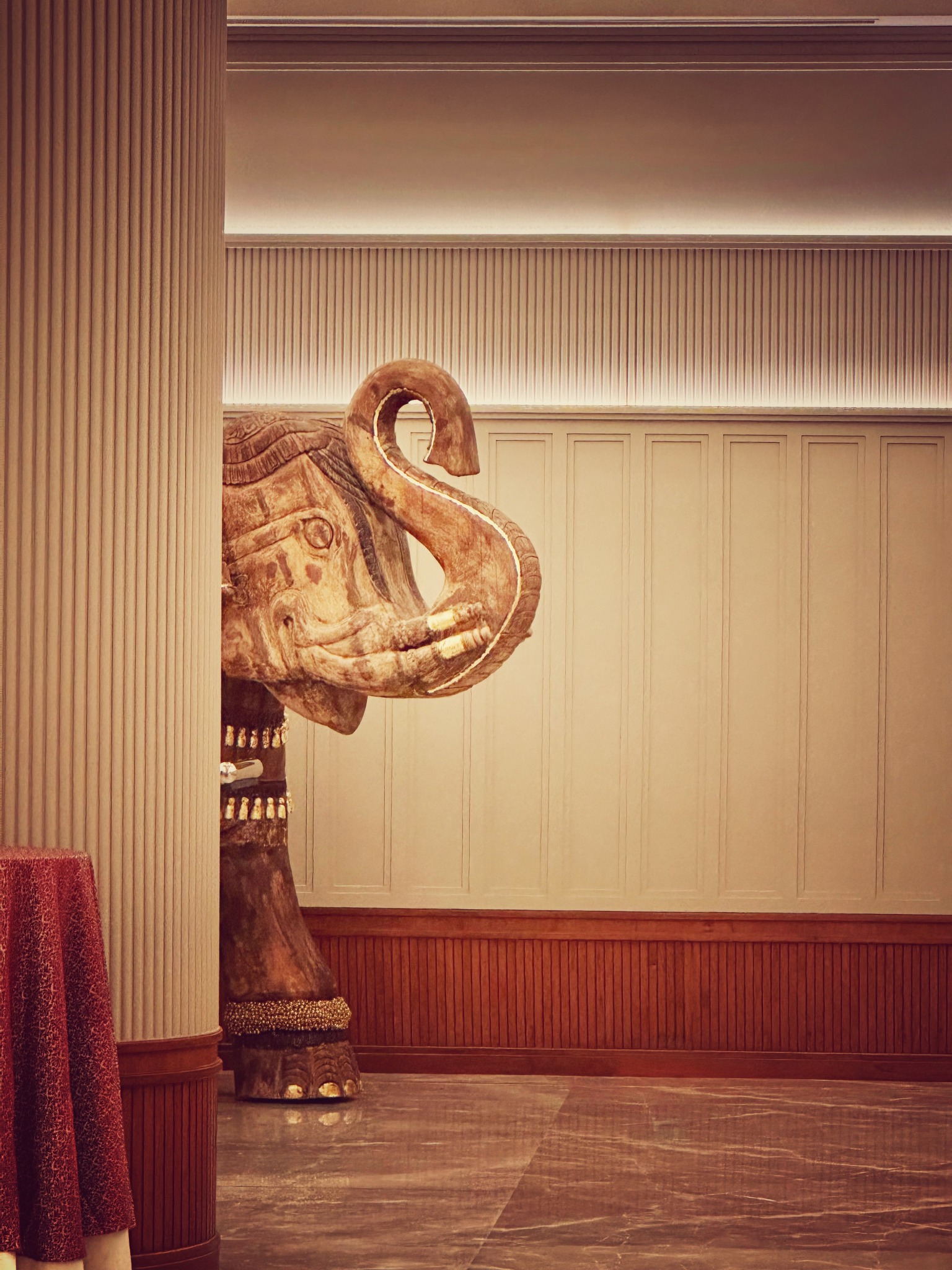 Elephant artwork within the interior material palette